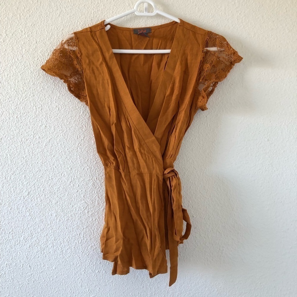 Burnt orange color peplum wrap shirt with lace sleeves size small